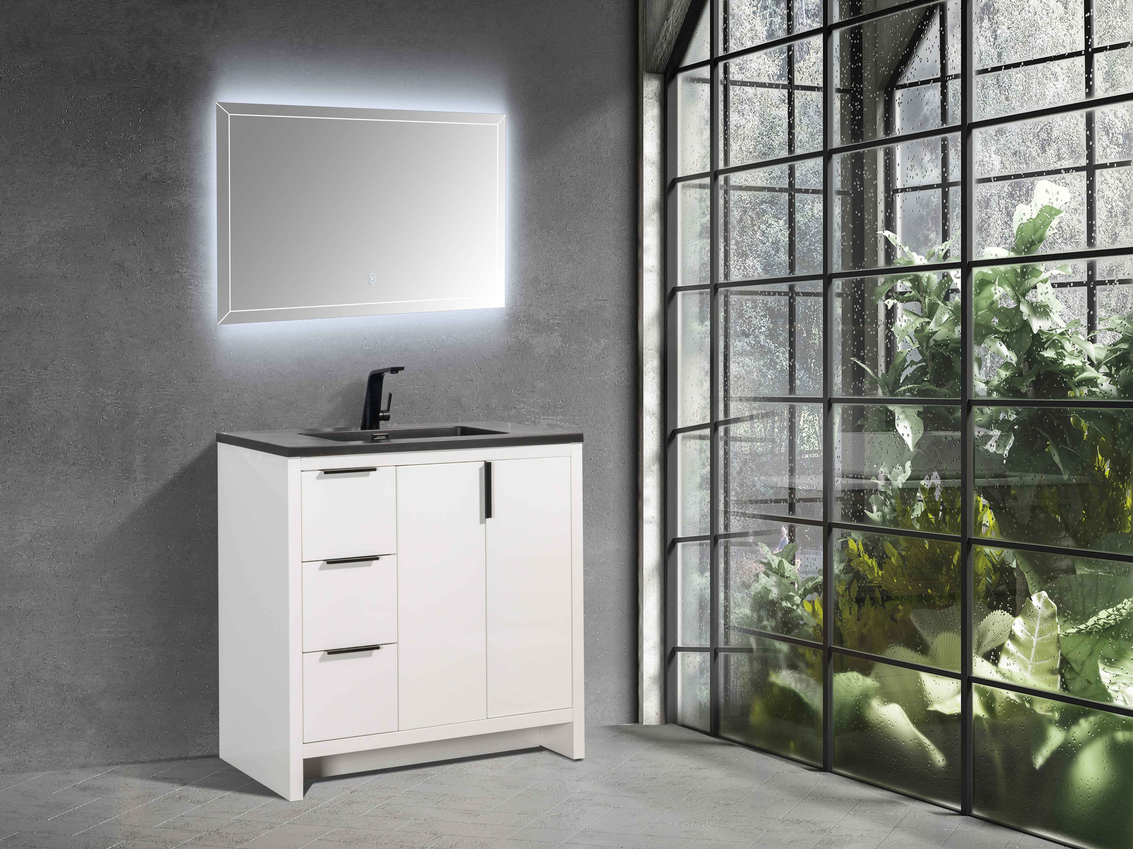 TONA Evana 36-inch white freestanding bathroom vanity with a matte black integrated sink and black faucet in a modern bathroom.