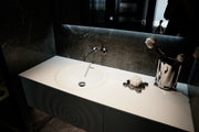 TONA Wave wall-mounted bathroom vanity features a unique ripple-like drawer front.